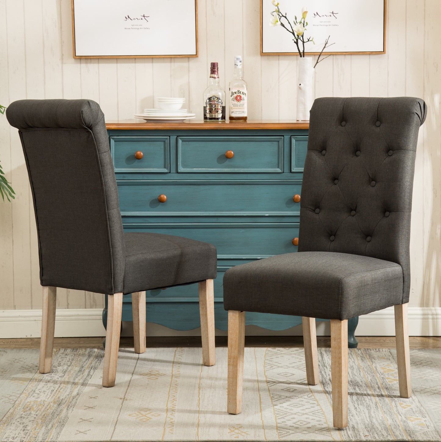 Dark grey tufted dining chair with natural wood legs perfect for a modern farmhouse kitchen