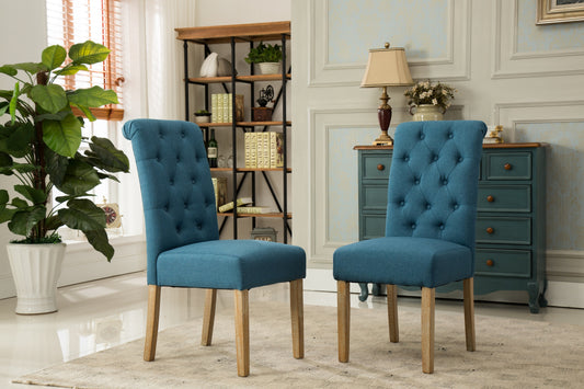 Tufted blue fabric dining chair with natural wood legs perfect for a modern farmhouse kitchen