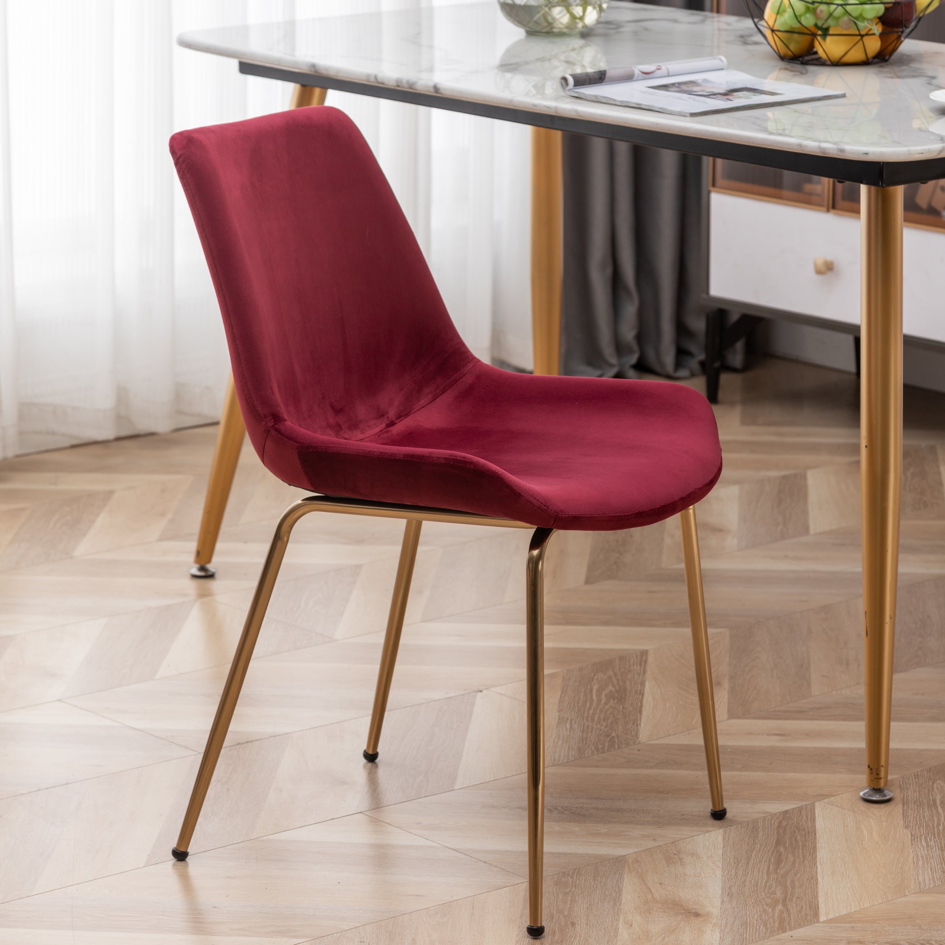 Burgundy velvet dining chair with modern gold metal legs elegant and comfortable