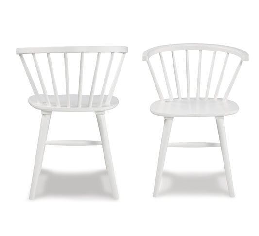 Two white spindle back dining chairs with wooden legs