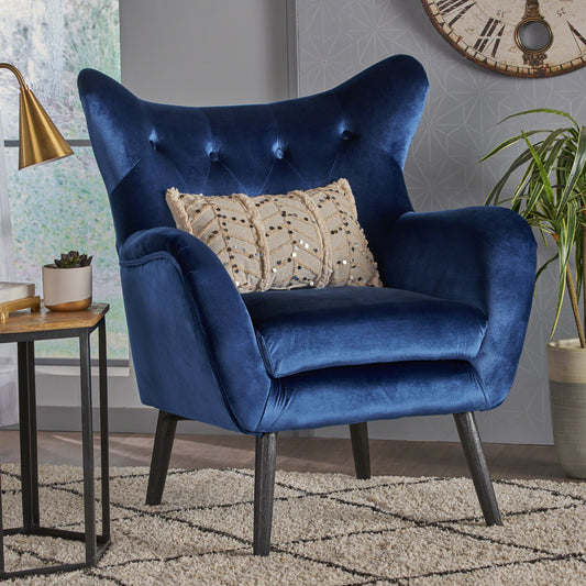 Deep blue velvet armchair with tufted back and plush seat cushion for modern living rooms