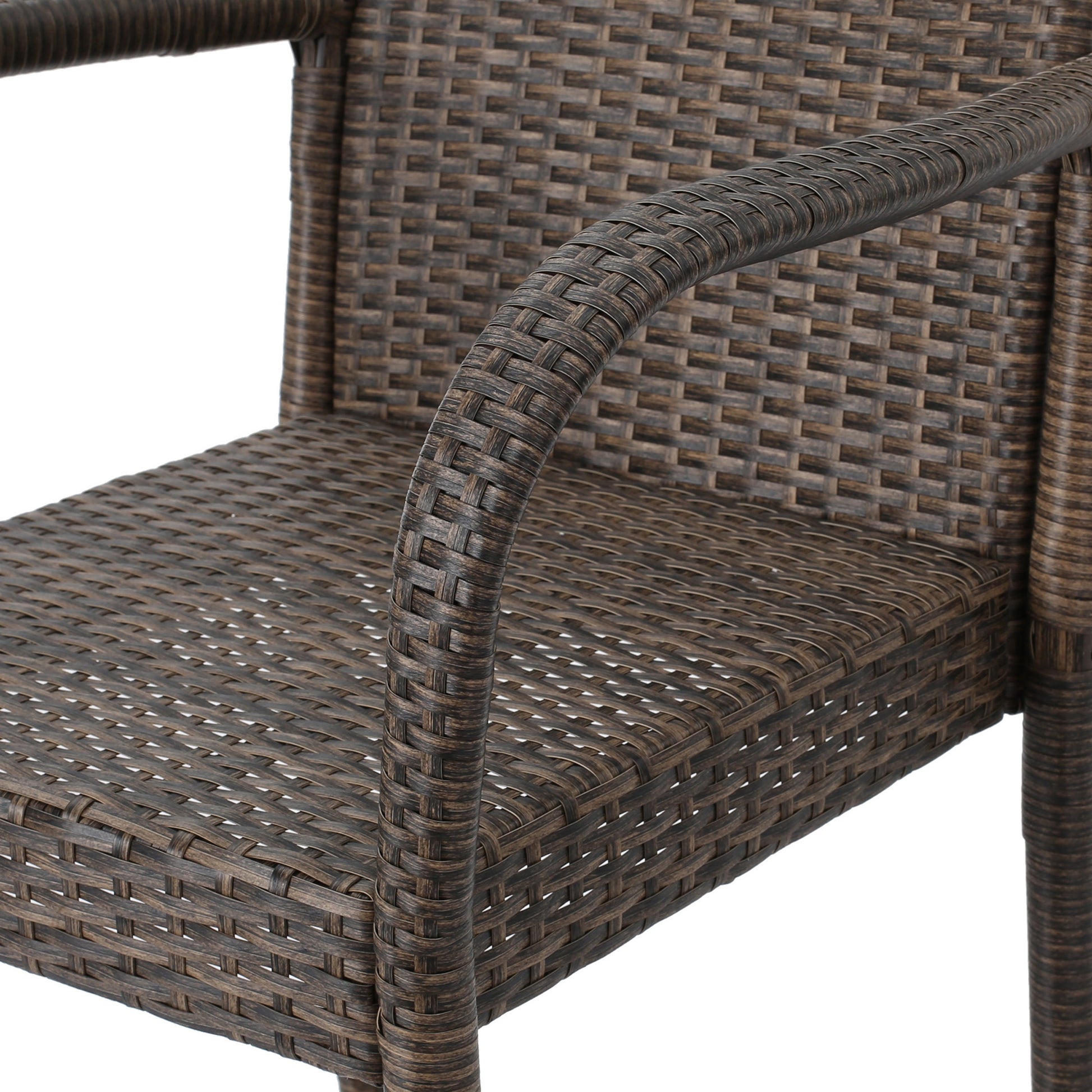 Brown wicker patio chair arm and seat detail for outdoor seating