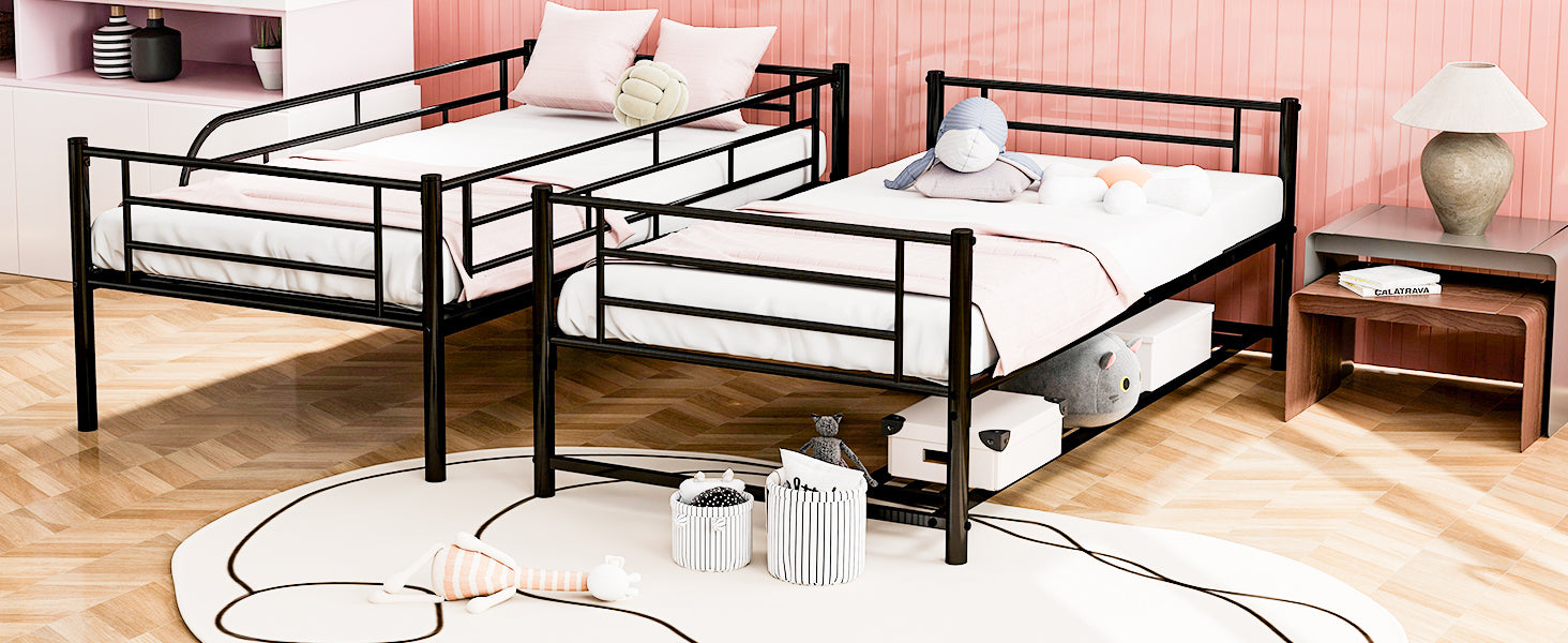 Black metal twin bunk beds with pink bedding and white mattresses