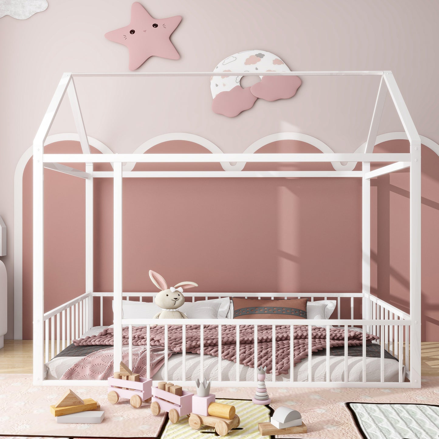 White wooden canopy bed with playful pastel bedding and toys