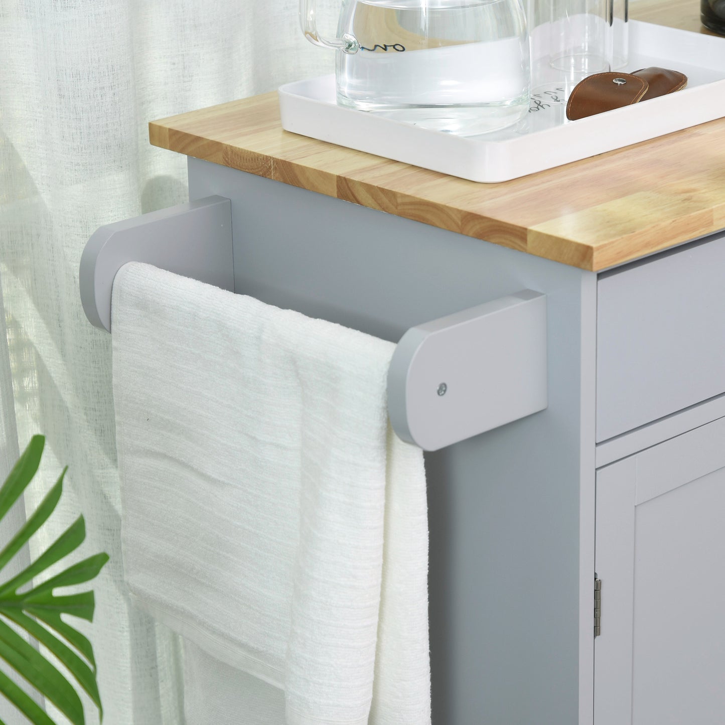 Gray kitchen cart with towel bar and wooden countertop
