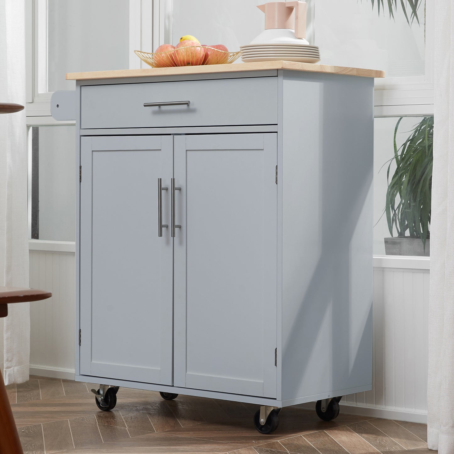 Gray kitchen cart with wooden countertop and two cabinet doors