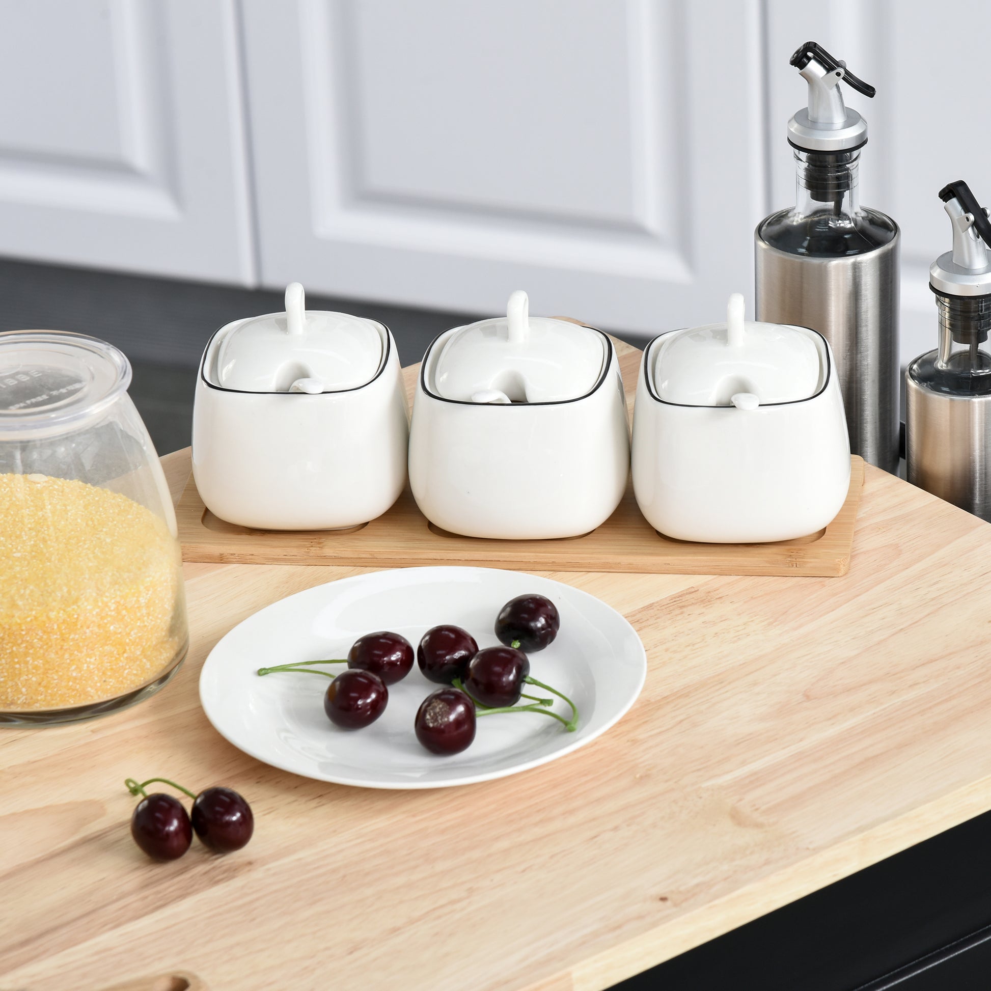 Set of  white ceramic sugar bowls with black trim and lids