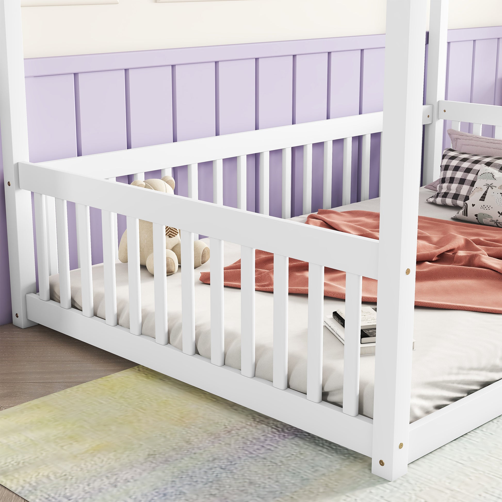 White wooden canopy bed frame with side rails and a teddy bear