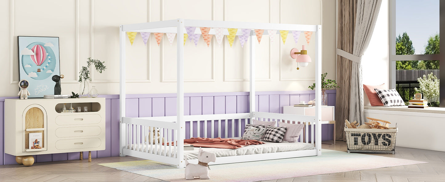 White canopy bed with heartpatterned bunting