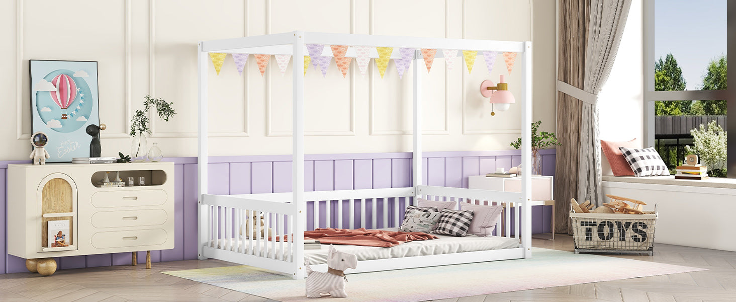 White canopy bed with heartpatterned bunting
