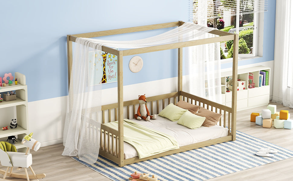 Natural wood toddler canopy bed with sheer drapes