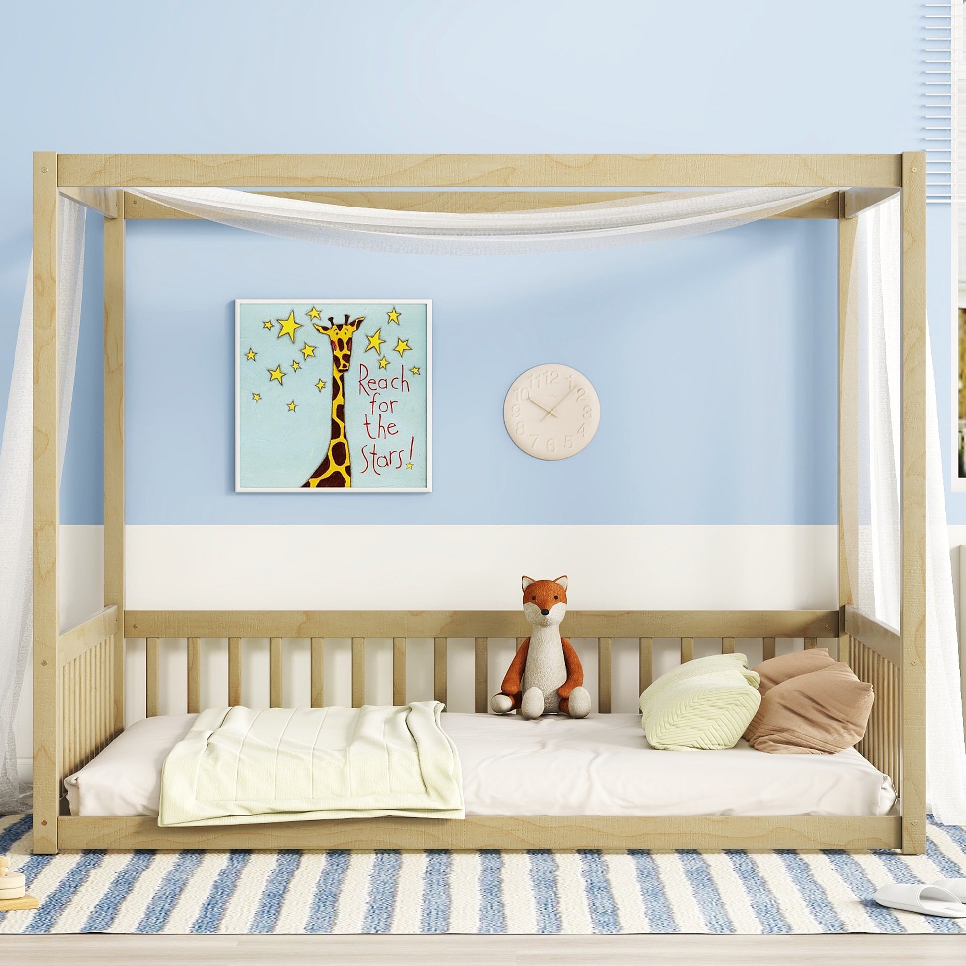 Wooden canopy bed frame with sheer curtains and childrens bedding