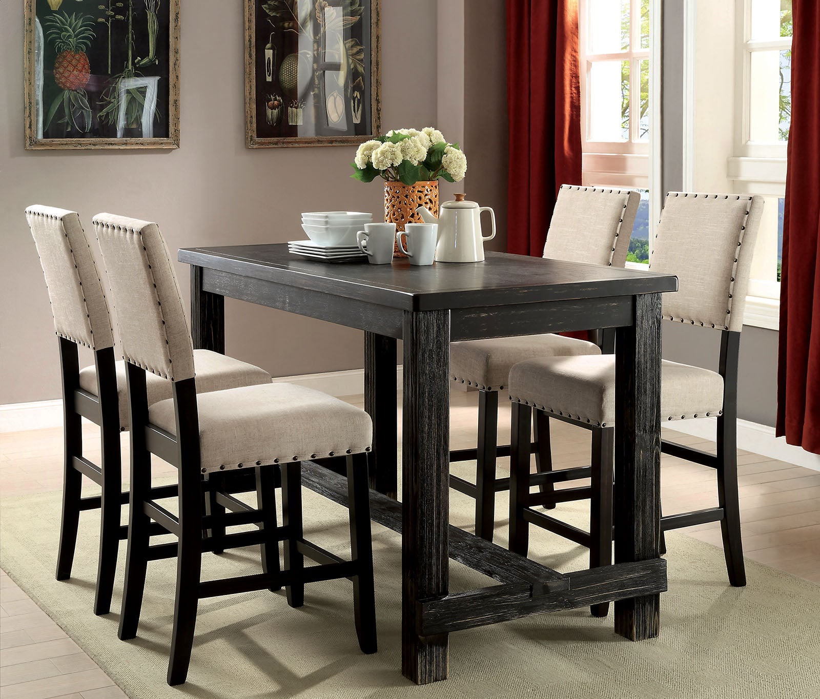 Rustic black wood pub table with four beige upholstered bar stools
