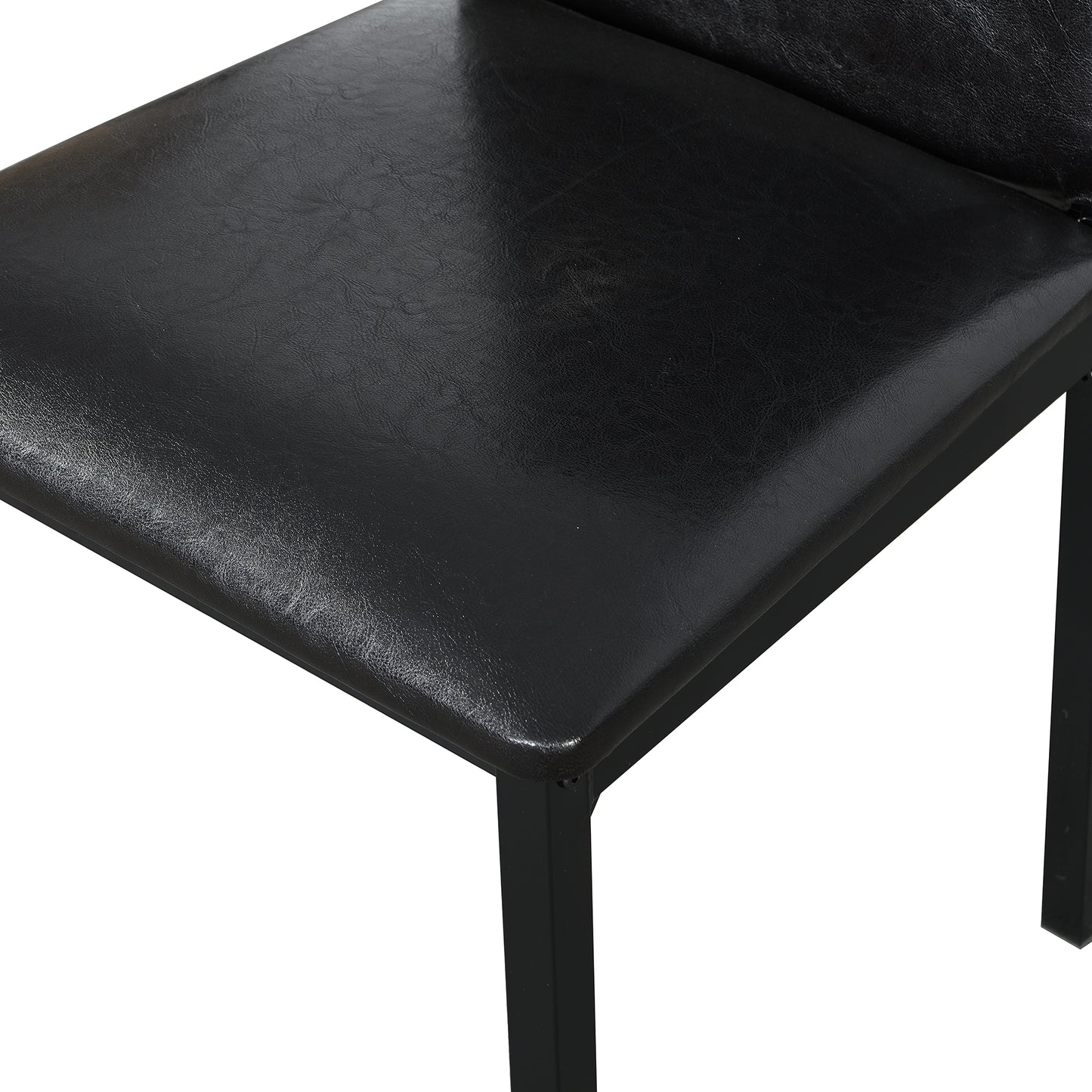 Close up of a black faux leather seat with a metal frame