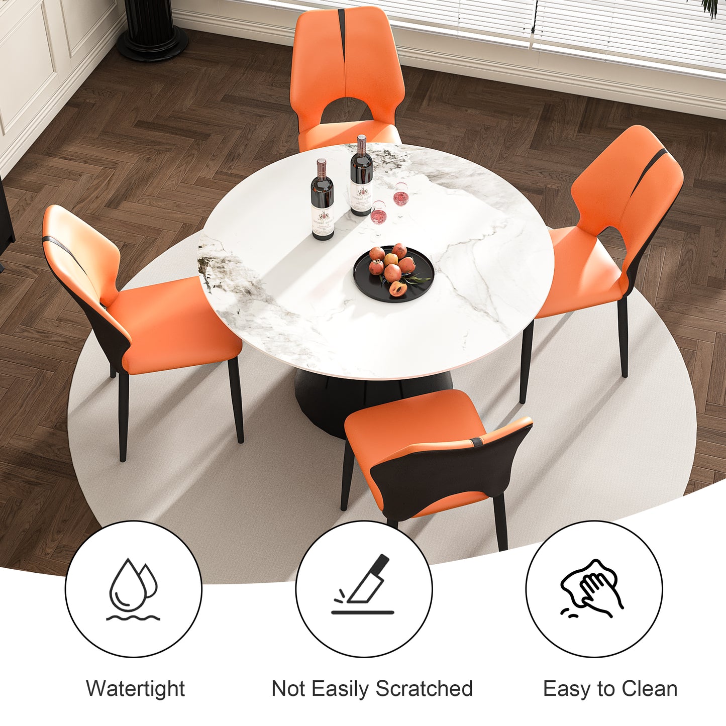 Modern dining set with four orange upholstered chairs and a white marblelook round table