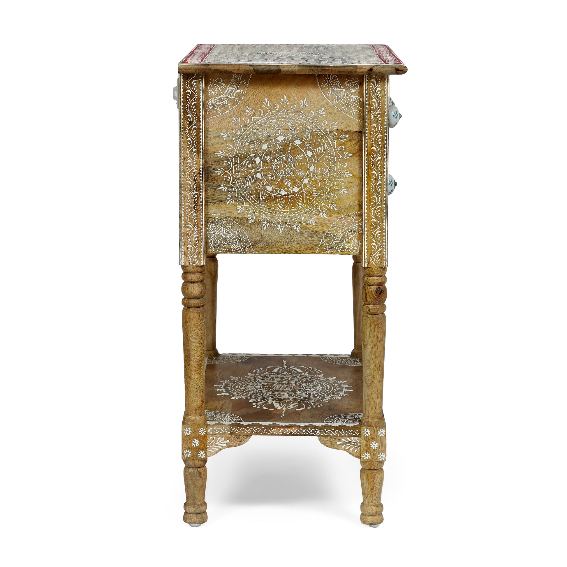 Ornate carved wooden side table with white mandala pattern and blue ceramic knobs