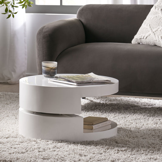 Modern white gloss nesting coffee table with magazines and books