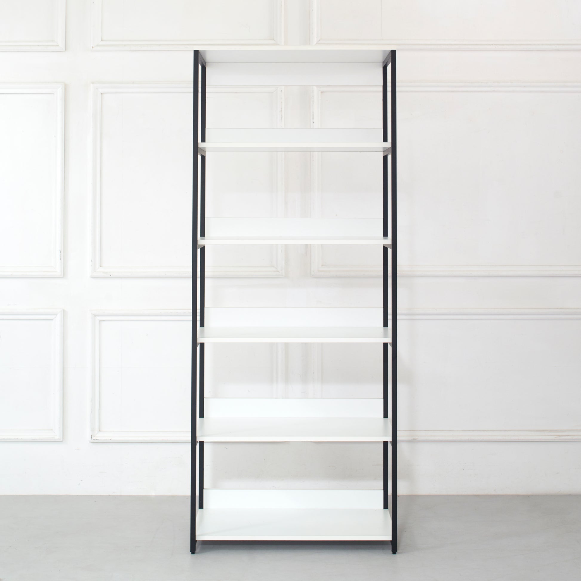 Tall white bookshelf with black metal frame