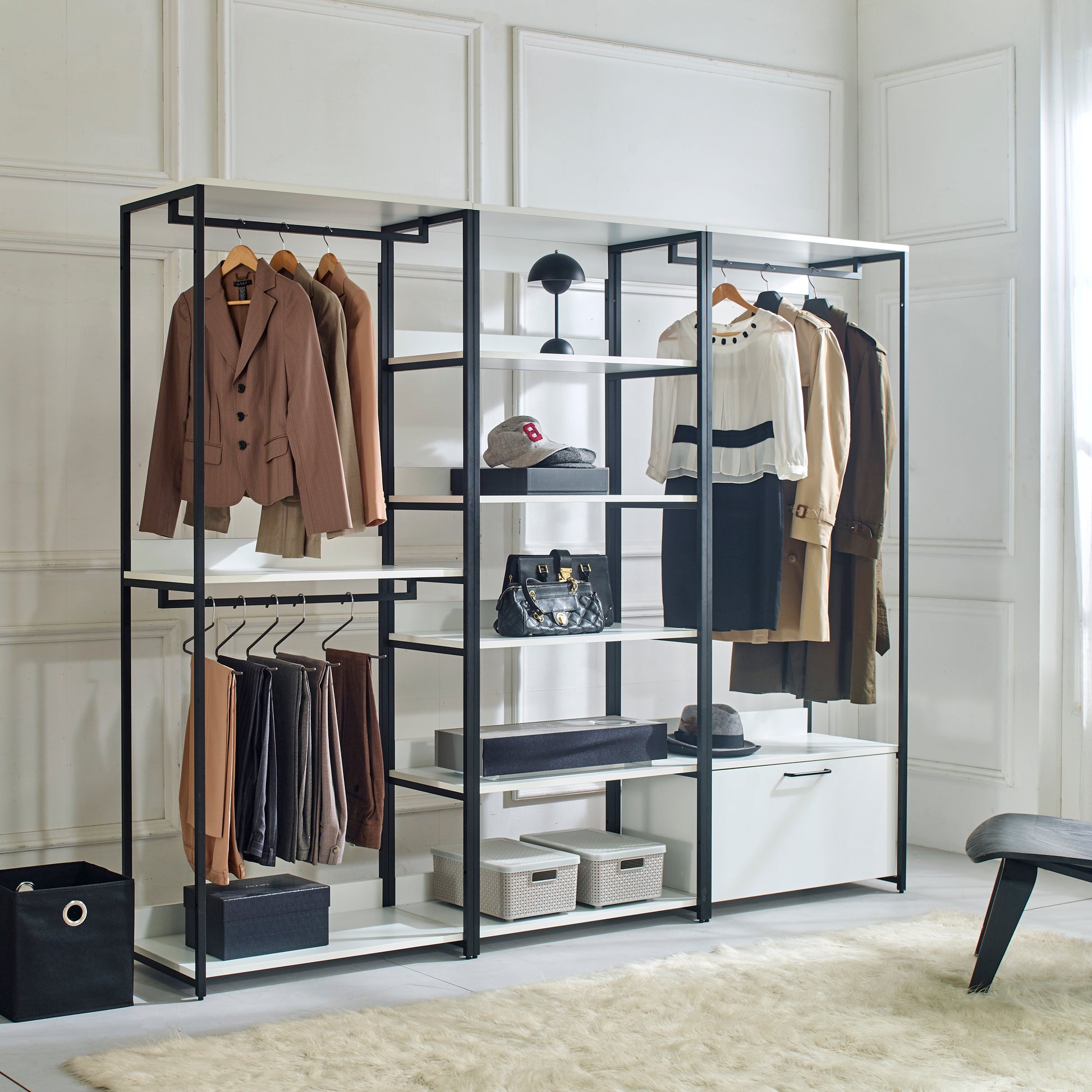 Brown pinstripe blazer hanging on an open wardrobe rack