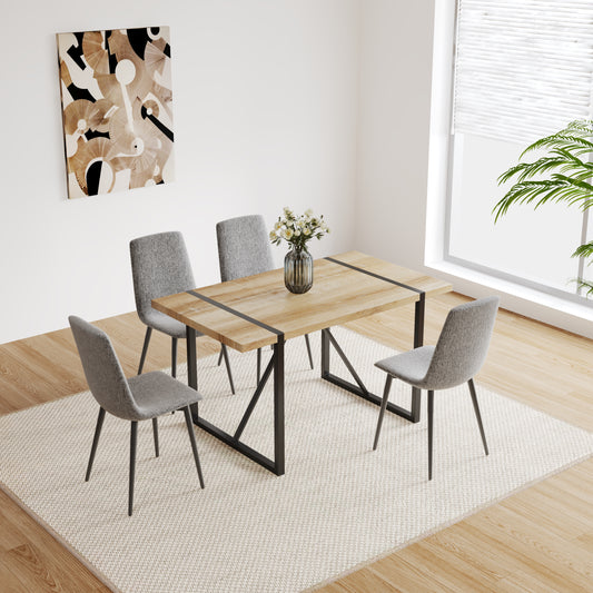 Wooden dining table with black metal legs and four grey fabric chairs