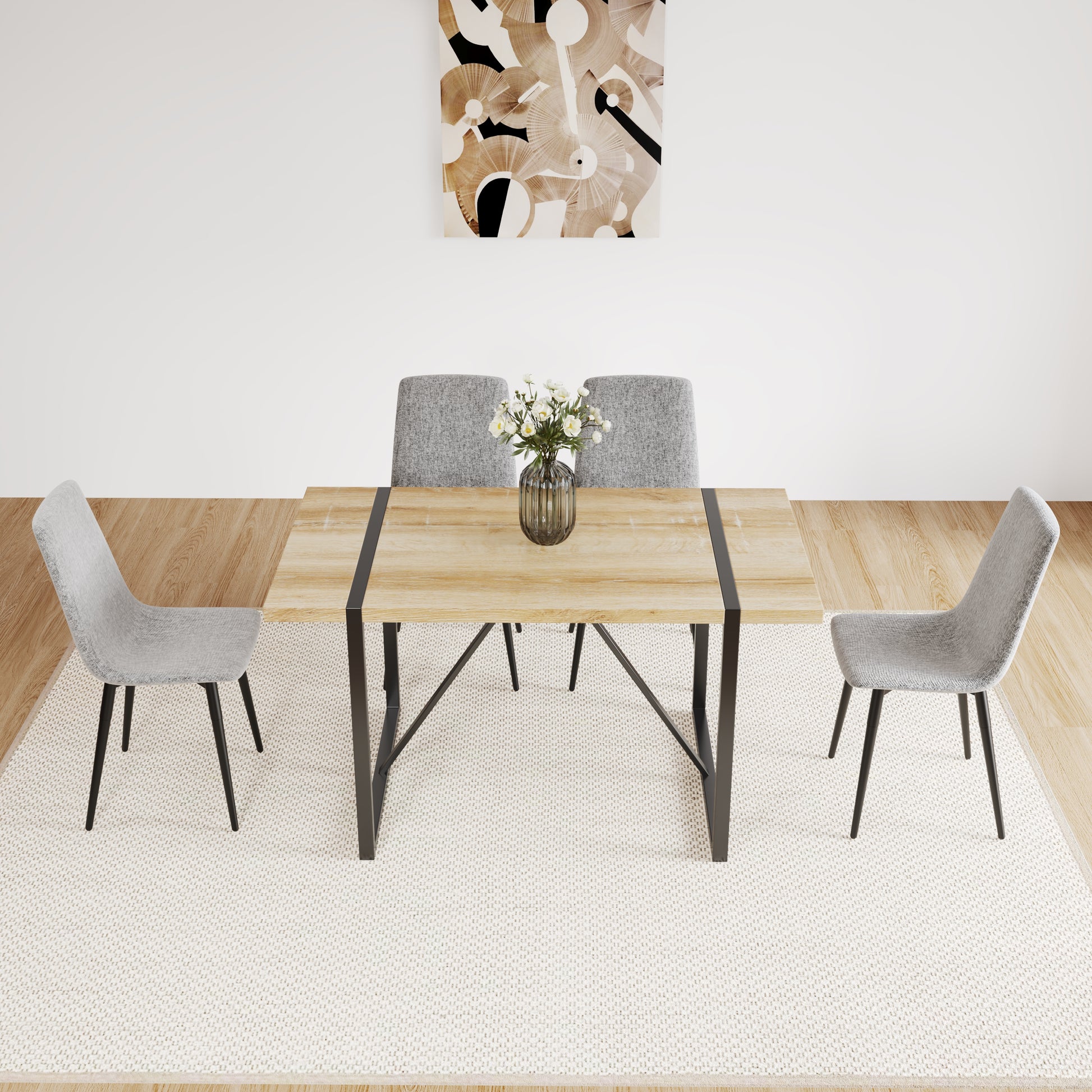 Modern light wood dining table with metal legs and four grey upholstered chairs