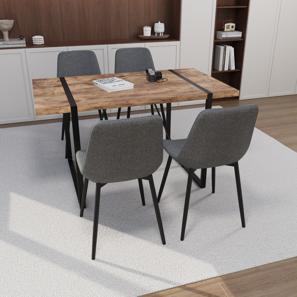 Rustic wood dining table with black metal legs and four grey fabric chairs