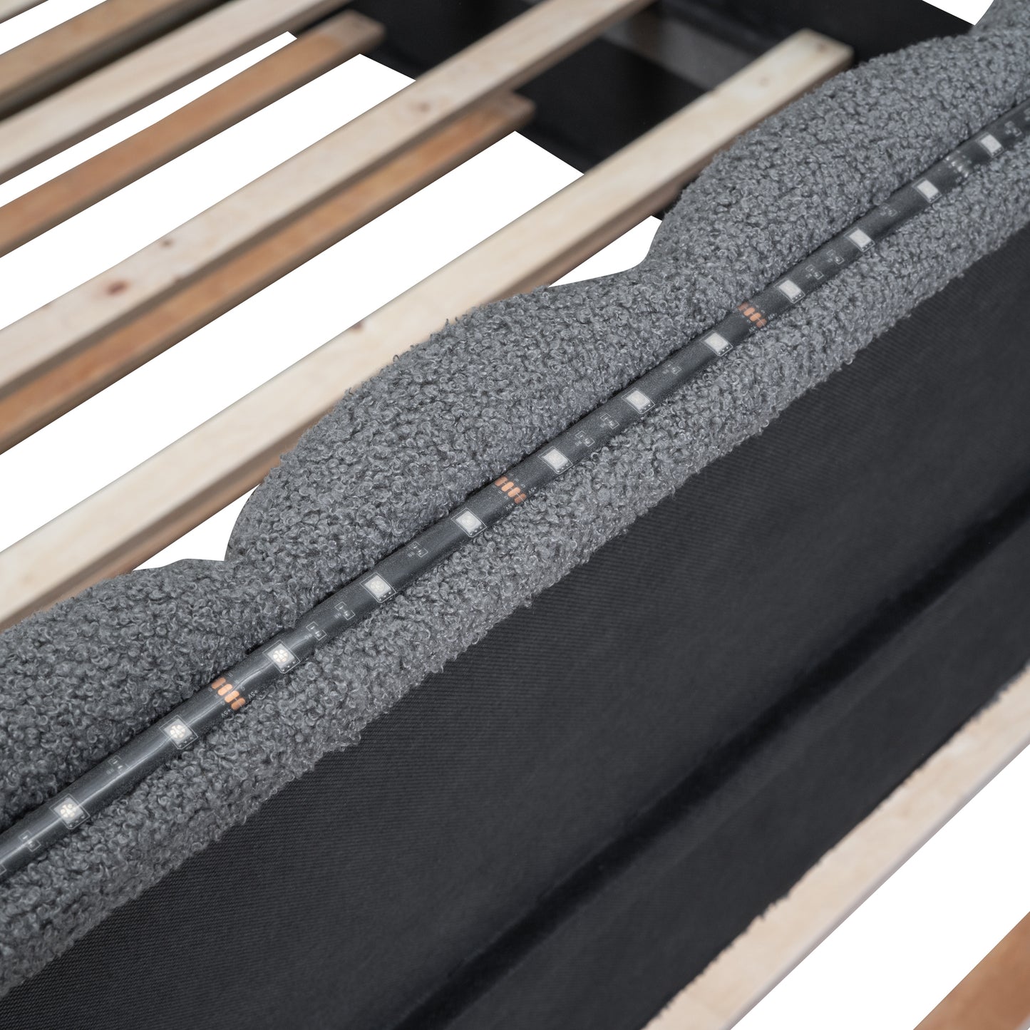 Grey boucle upholstered bed frame with integrated LED strip lighting