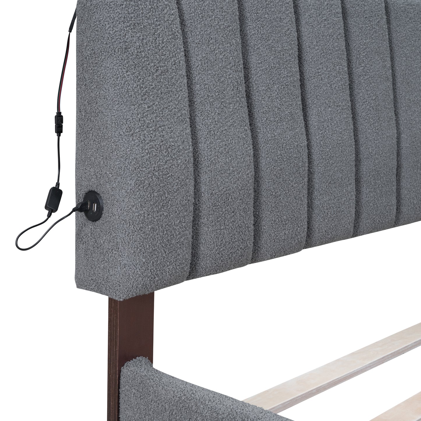 Grey upholstered headboard with integrated USB ports and charging cable