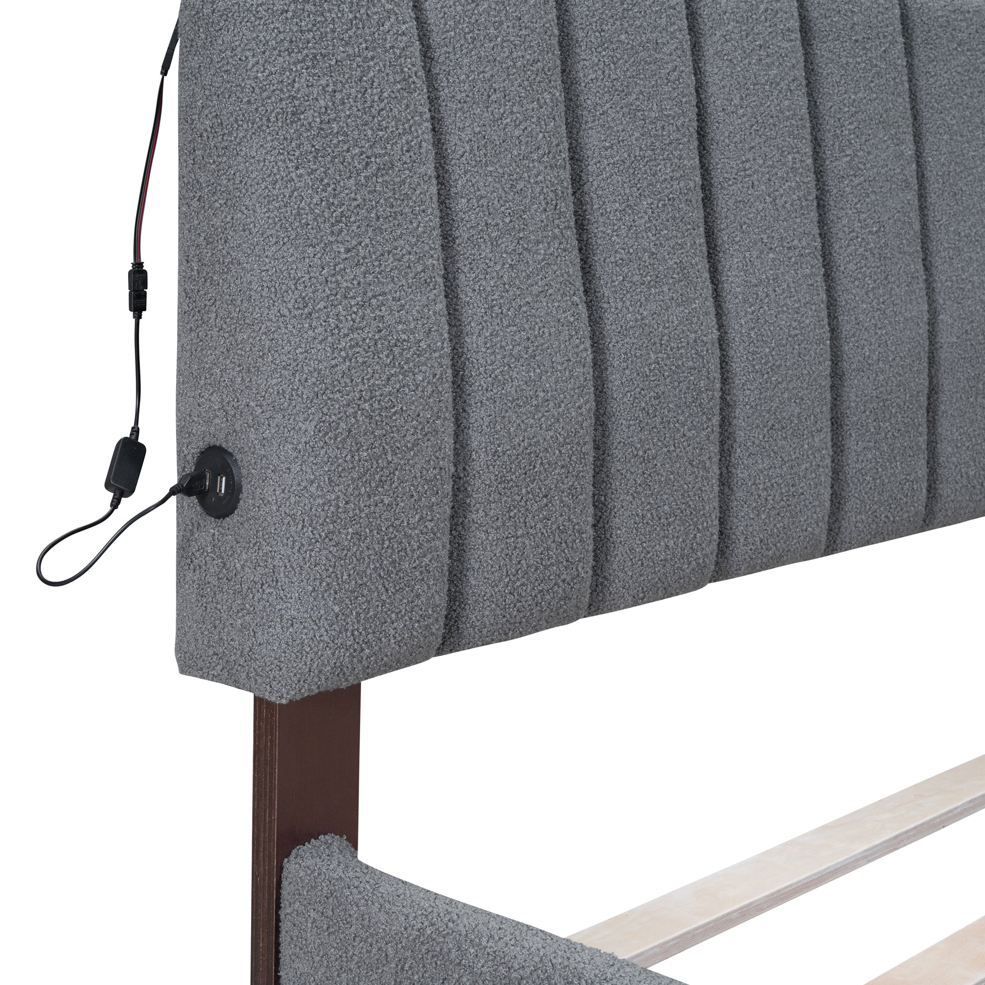 Grey upholstered headboard with integrated USB ports and charging cable