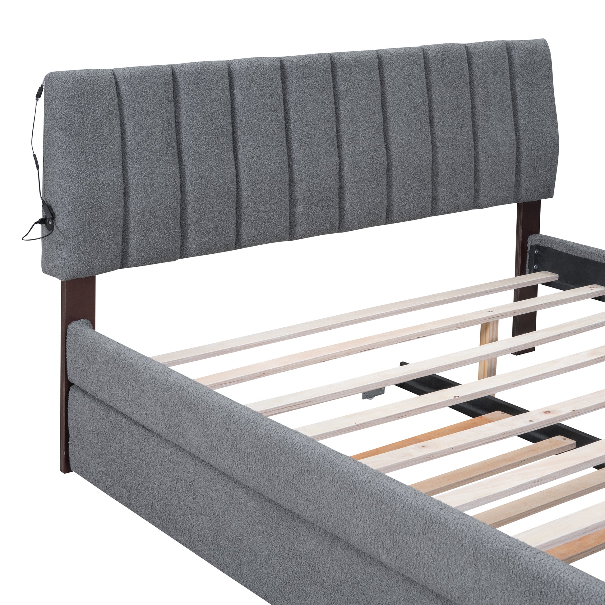 Gray upholstered platform bed frame with vertical channel tufted headboard and integrated USB ports