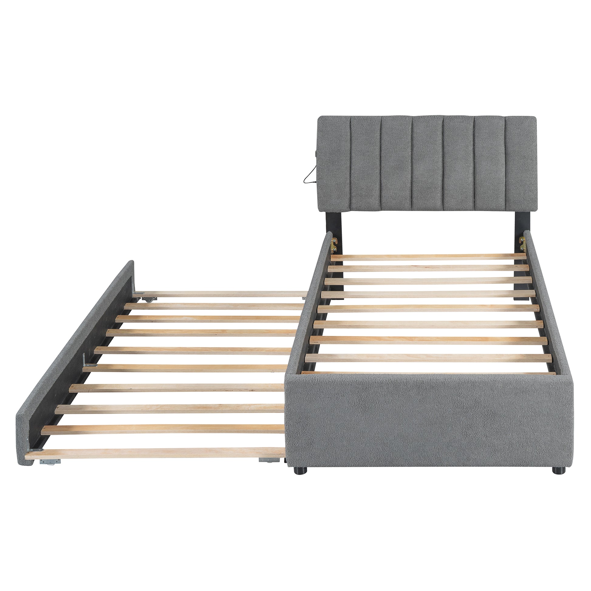 Gray upholstered trundle bed frame with wooden slats and channeltufted headboard