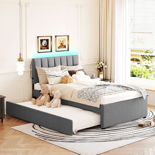 Gray upholstered twin bed with pullout trundle ideal for kids rooms