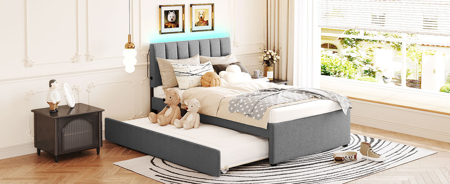Grey upholstered twin bed with a pullout trundle perfect for kids rooms