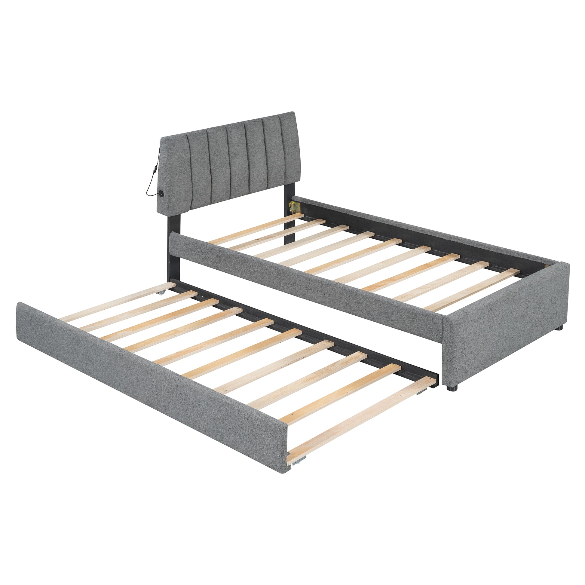 Gray upholstered twin daybed with pullout trundle and USB charging port