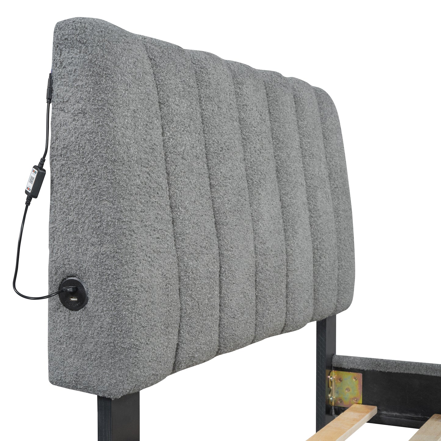 Gray upholstered headboard with builtin USB ports and channels