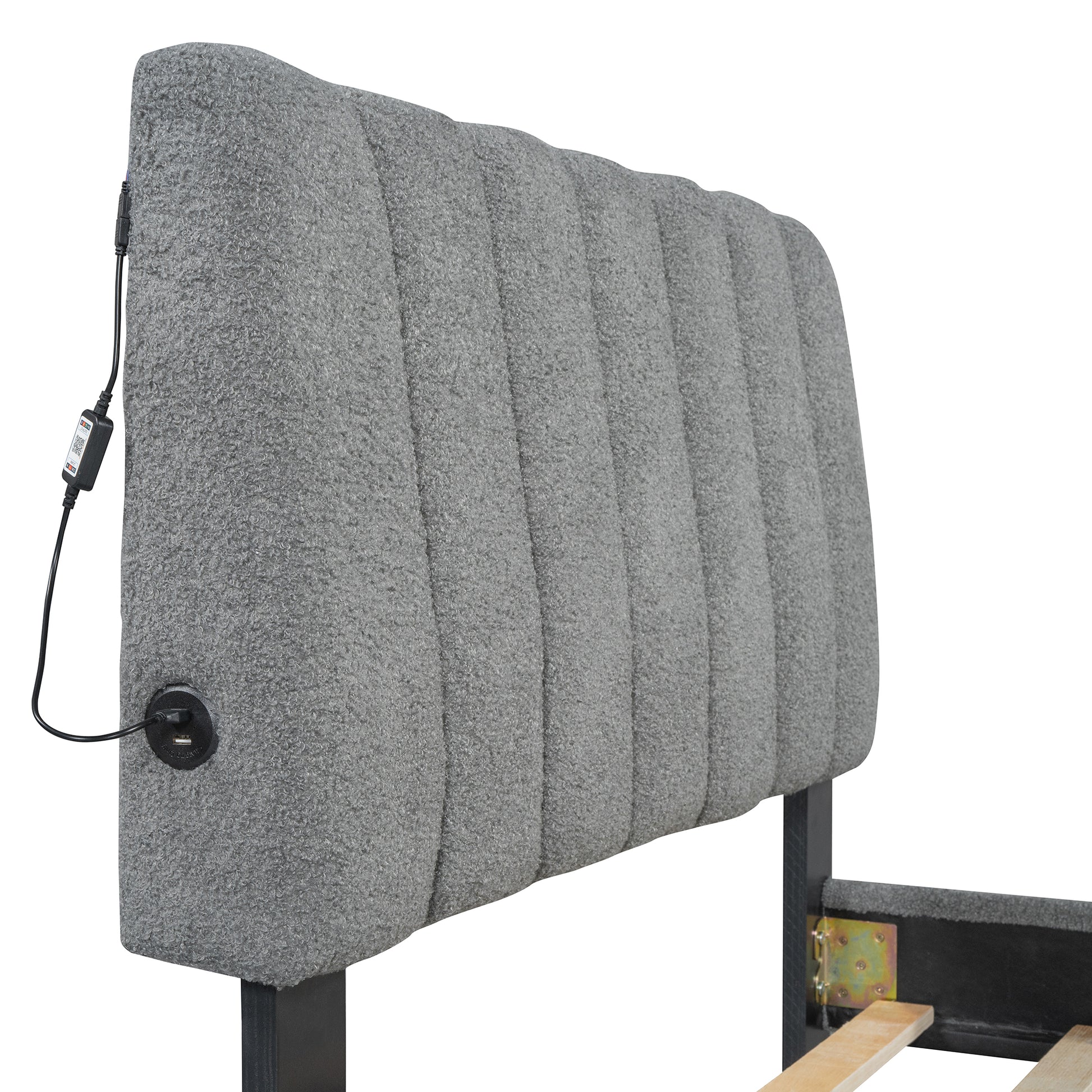 Gray upholstered headboard with builtin USB ports and channels