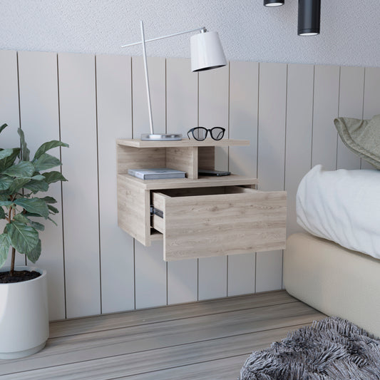 Floating bedside table with natural wood finish and open drawer