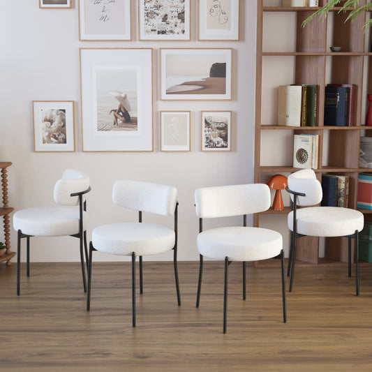 White boucle dining chair with black metal legs
