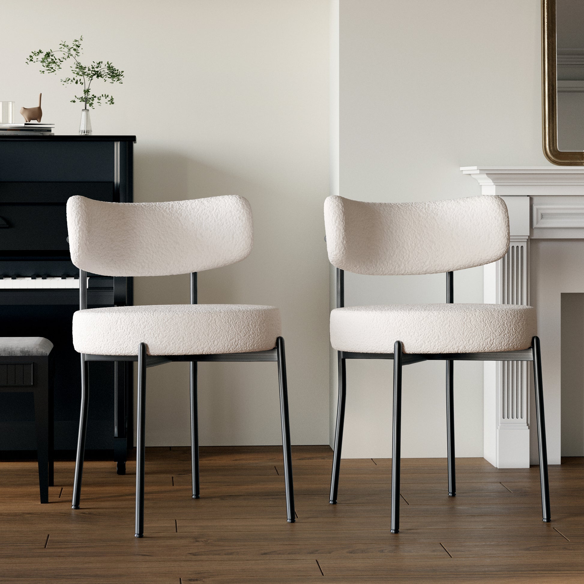 Cream boucle dining chair with black metal legs