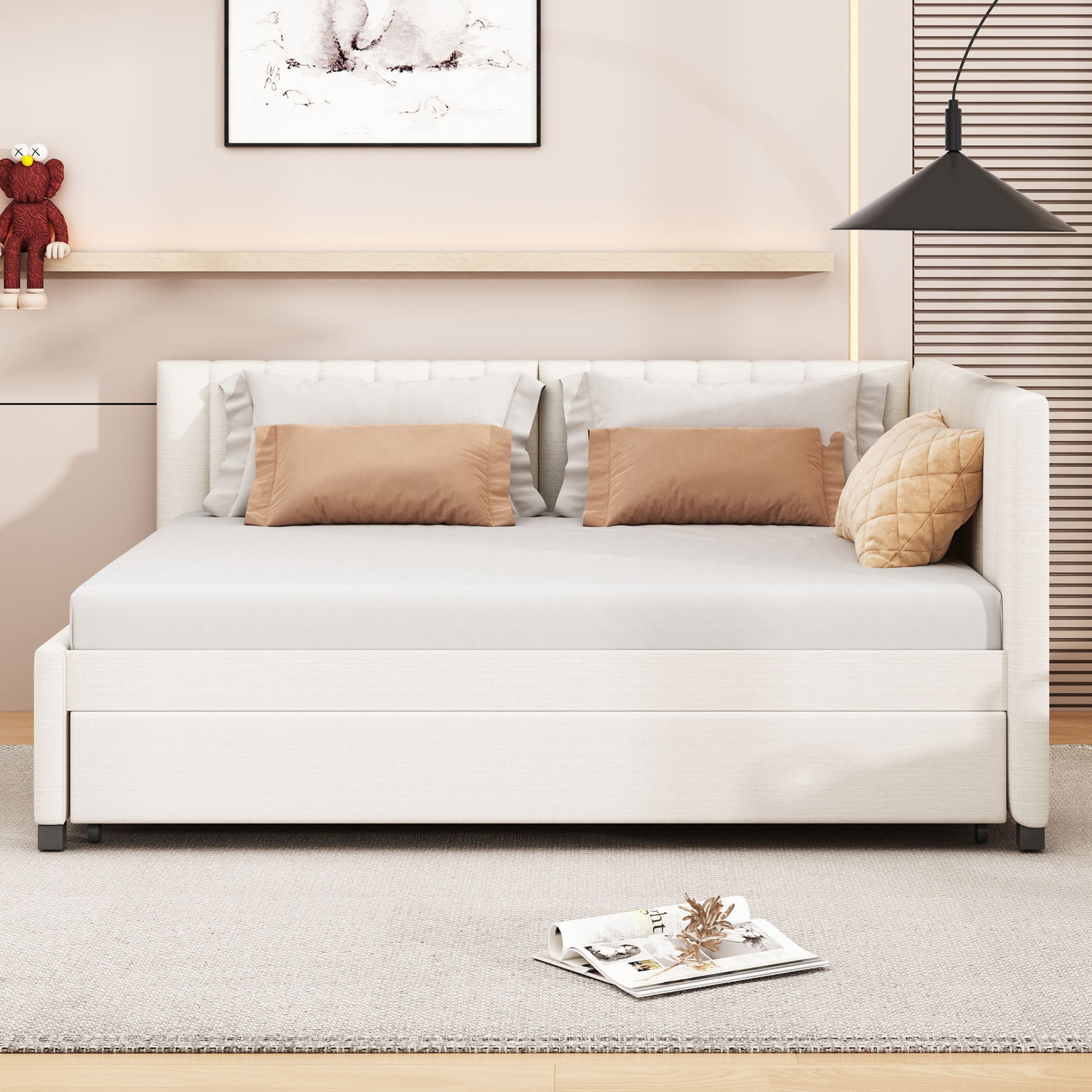 White upholstered daybed with plush brown accent pillows and a tufted armrest