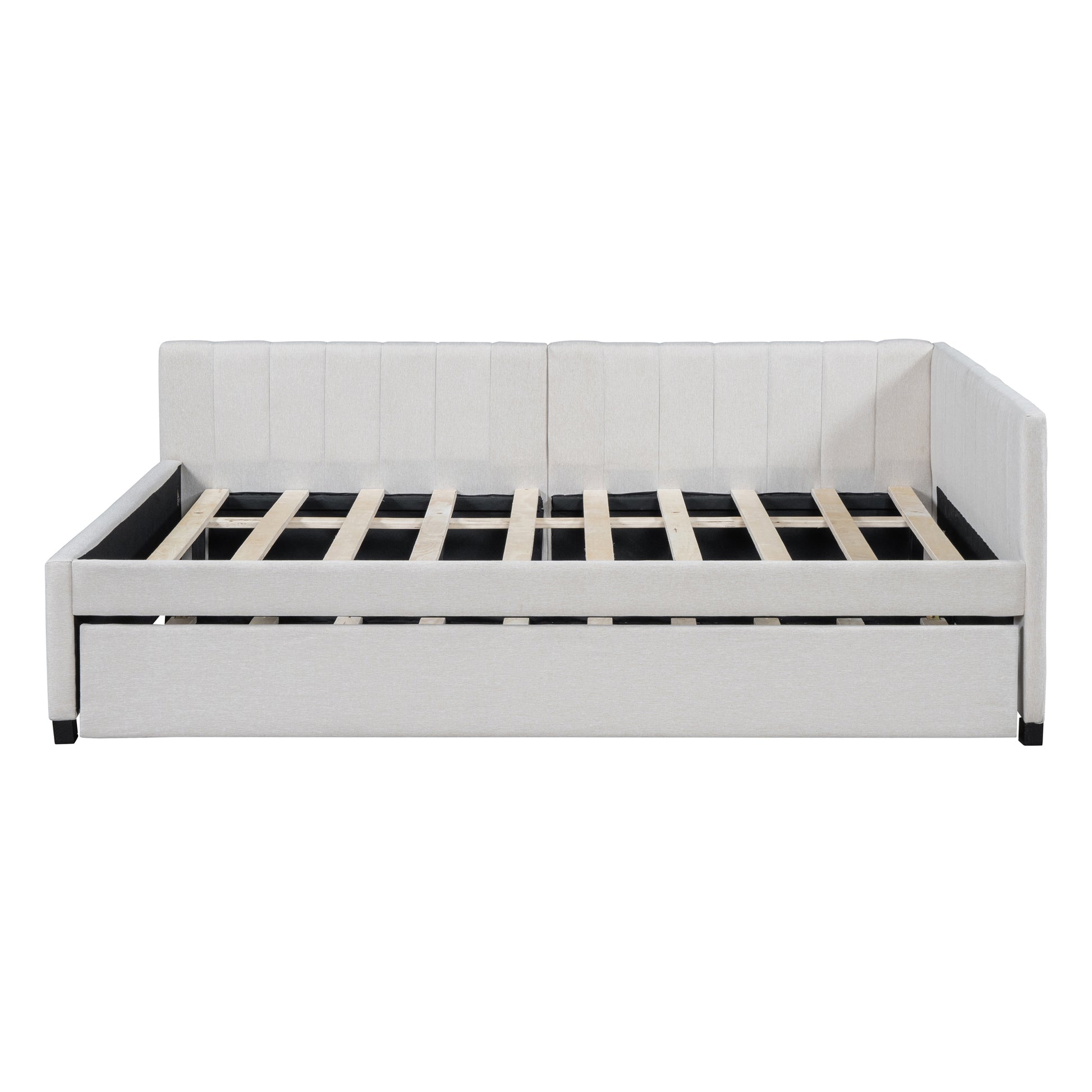 Light beige fabric daybed with tufted back and pullout trundle