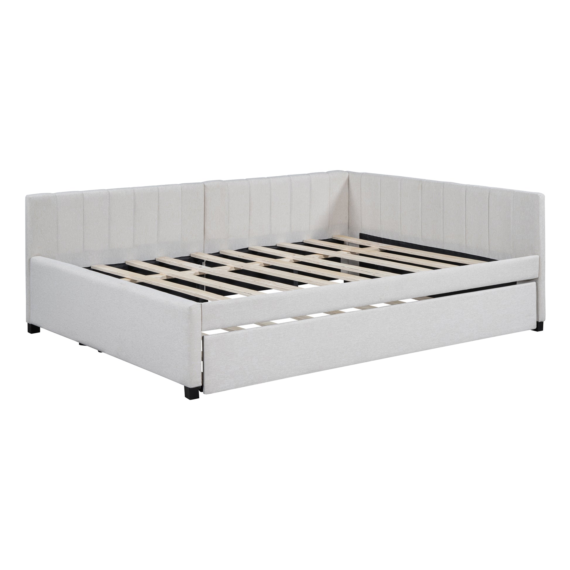 Cream upholstered daybed with integrated pullout trundle and slatted frame