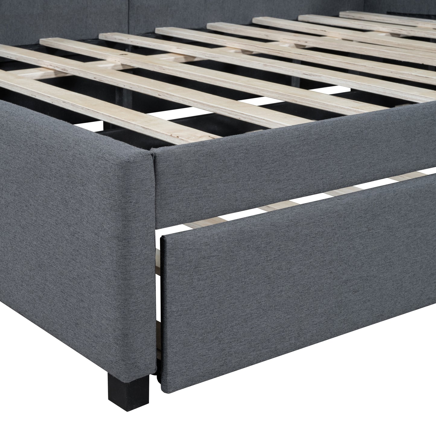 Dark grey upholstered bed frame showing wooden slats