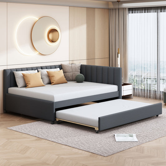 Dark grey upholstered daybed with pullout trundle perfect for guest rooms