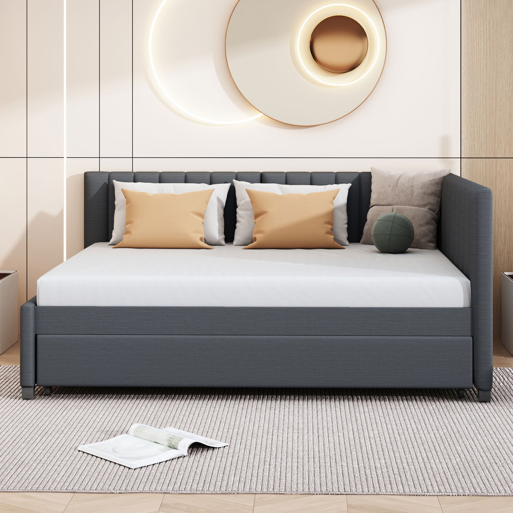 Dark grey upholstered daybed with tufted headboard and crisp white bedding