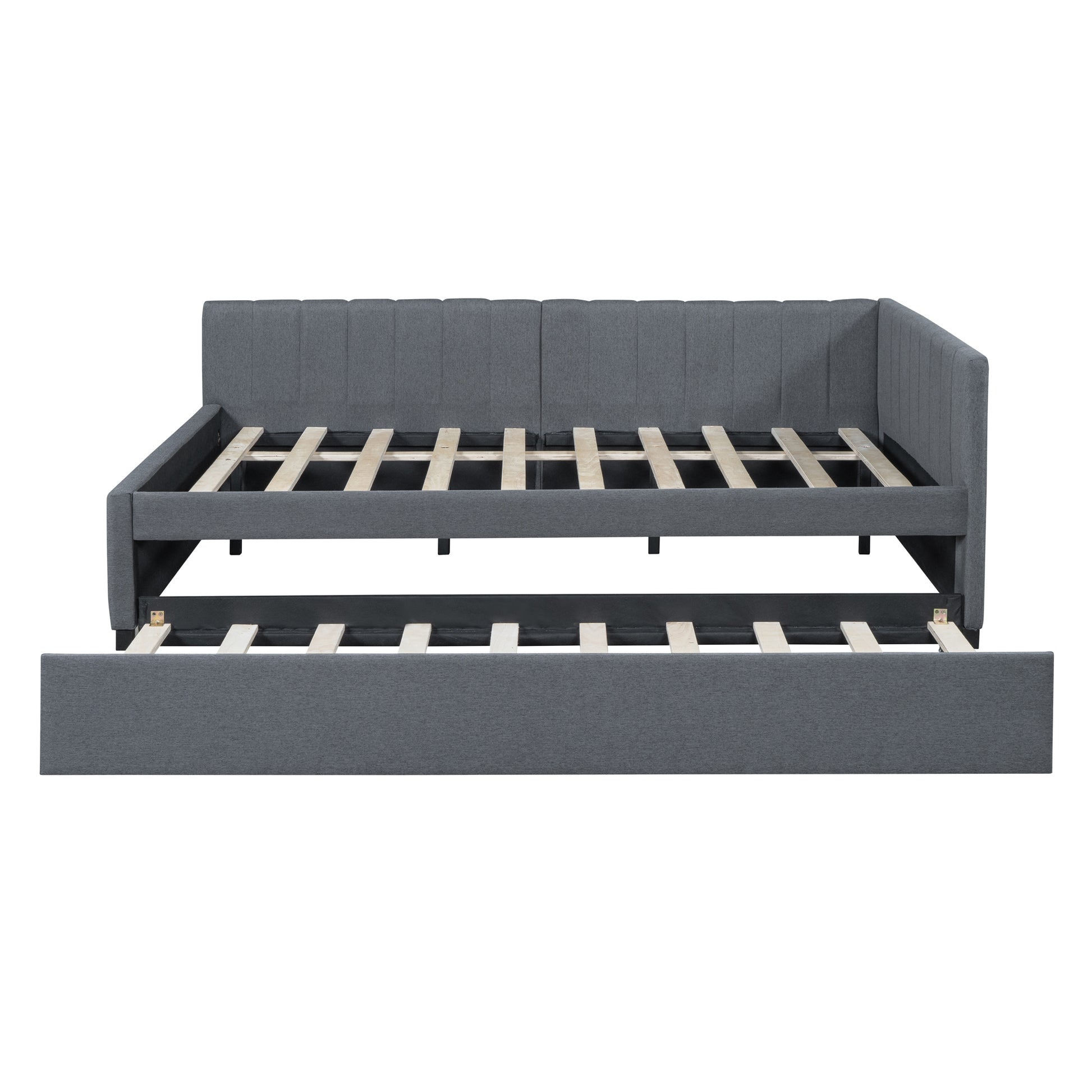 Gray upholstered daybed with pullout trundle and slatted frames perfect for guest rooms