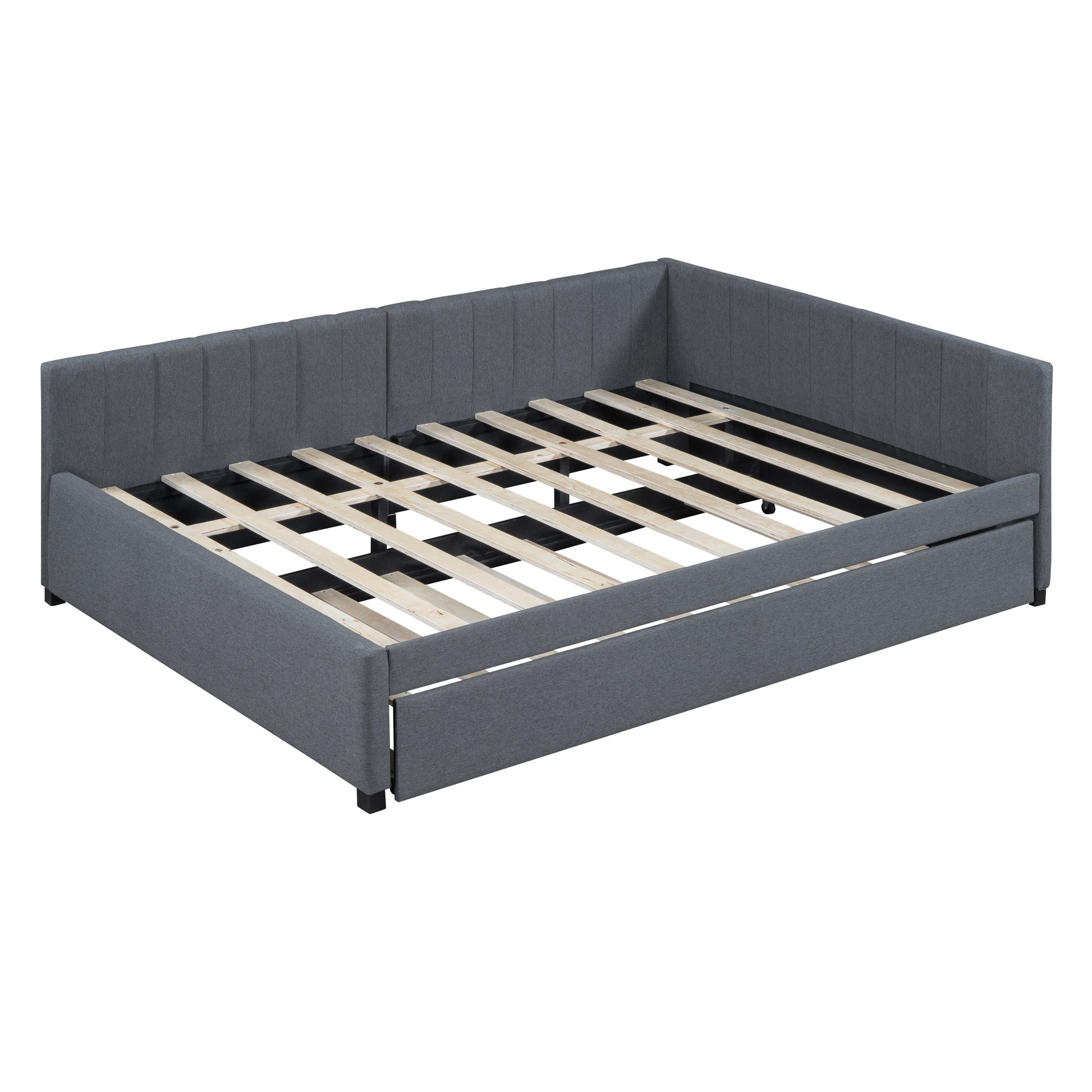 Gray upholstered daybed with rollout trundle and wooden slats
