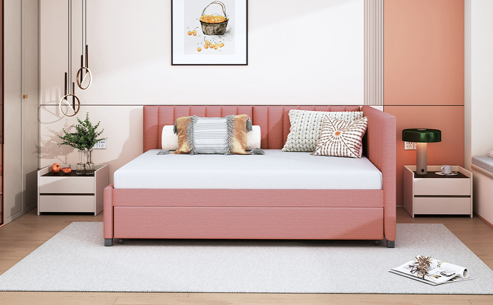 Pink upholstered daybed with fluted headboard and white mattress