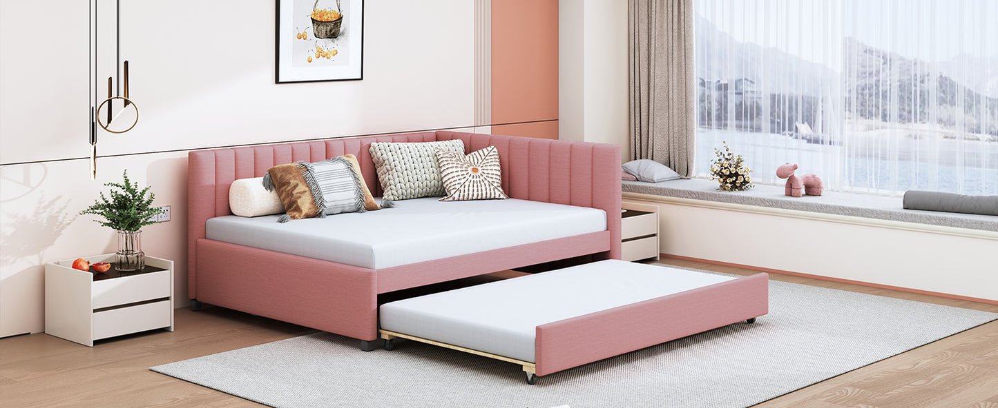 Pink upholstered daybed with pullout trundle