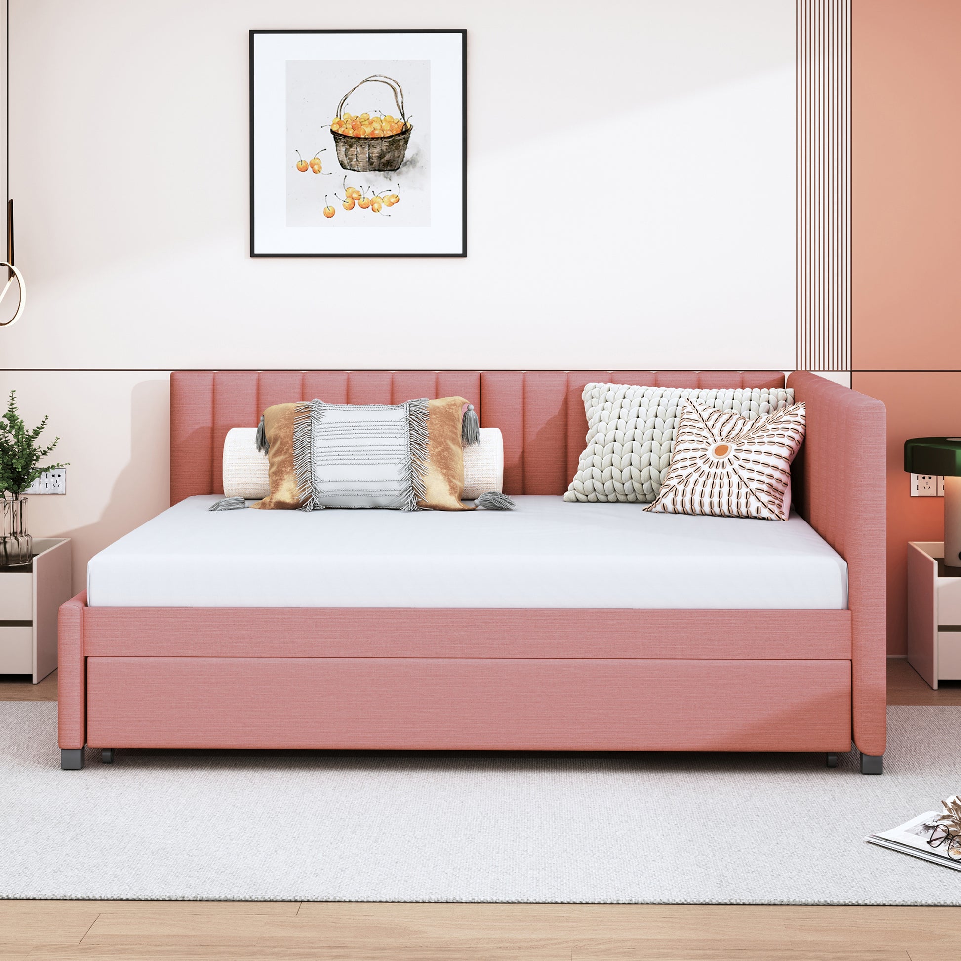 Modern rose pink upholstered daybed with plush pillows and a clean mattress